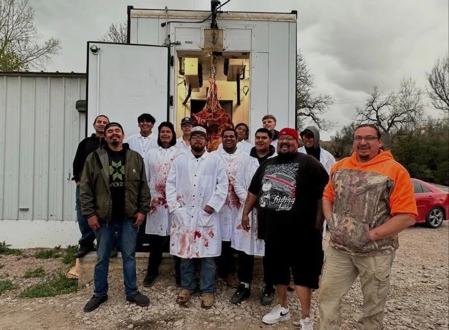 Sacred Storm Buffalo apprentices and mentors gather together at the processing facility after a harvest